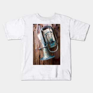 Weathered Tuba Hanging On Old Wall Kids T-Shirt